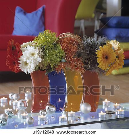 Stock Photo - Still-Life of multi-coloured flowers in colourful vases. Fotosearch