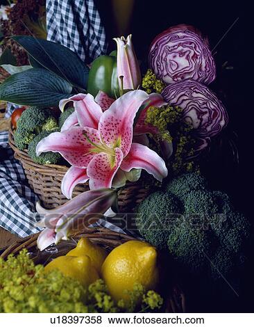 Stock Photo - Still-Life of pink lily and vegetables. Fotosearch