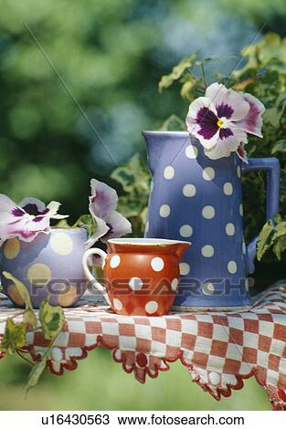 Stock Image - Still-Life of red and blue spotted jugs. Fotosearch