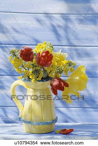 Picture - Still-Life of red and yellow tulips in yellow jug. Fotosearch