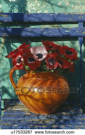 Still-Life of red anemones in orange jug View Large Photo Image Stock Photo - Still-Life of red anemones in orange jug. Fotosearch