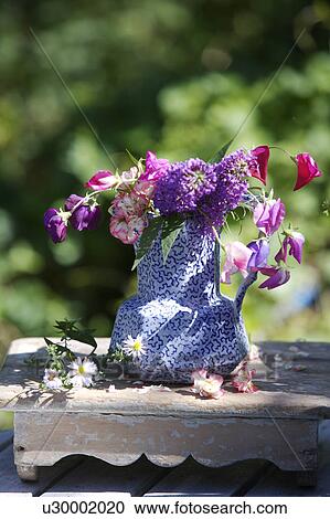 Still-Life of summer flowers in blue jug View Large Photo Image Stock Image - Still-Life of summer flowers in blue jug. Fotosearch