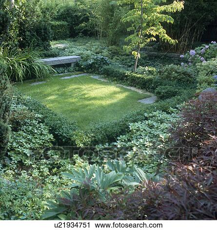 Stone bench and shady lawn in green country garden in summer View Large Photo Image Stock Image - Stone bench and shady lawn in green country garden in summer. Fotosearch