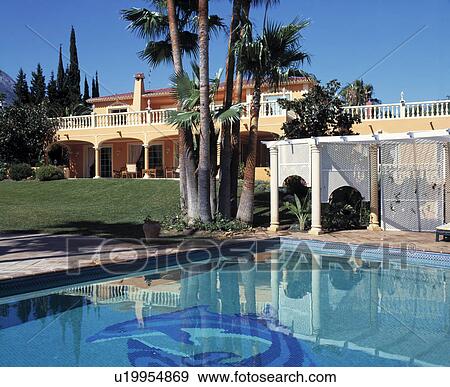 Swimming pool in front of large villa in southern Spain View Large Photo Image Stock Photo - Swimming pool in front of large villa in southern Spain. Fotosearch
