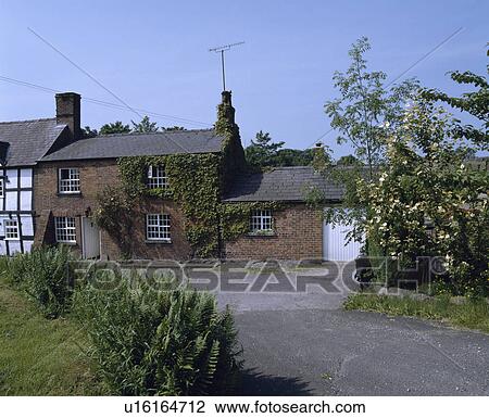 Stock Image - Terraced cottages in country village. Fotosearch