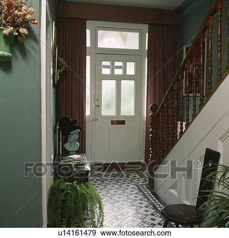 Tessellated tiled floor in green hall with glass panels in the front door View Large Photo Image Stock Photo - Tessellated tiled floor in green hall with glass panels in the front door. Fotosearch