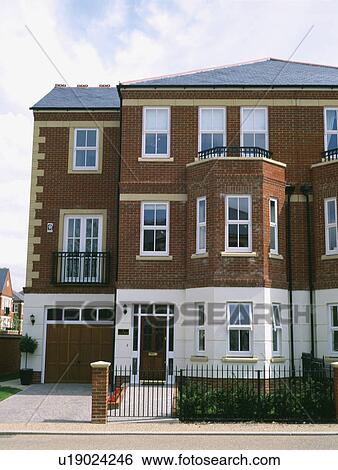 Three storey semi detached newbuild traditional townhouse View Large Photo Image Stock Photograph - Three storey semi detached newbuild traditional townhouse. Fotosearch
