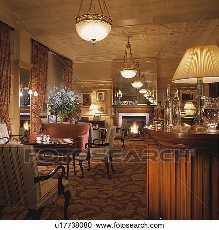 Traditional bar with comfortable seating in large old style London hotel. View Large Photo Image Stock Image - Traditional bar with comfortable seating in large old style London hotel.. Fotosearch