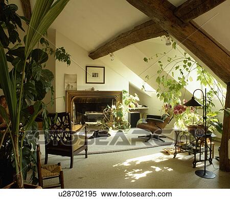 Traditional cream attic living room with beamed ceiling View Large Photo Image Stock Photography - Traditional cream attic living room with beamed ceiling. Fotosearch