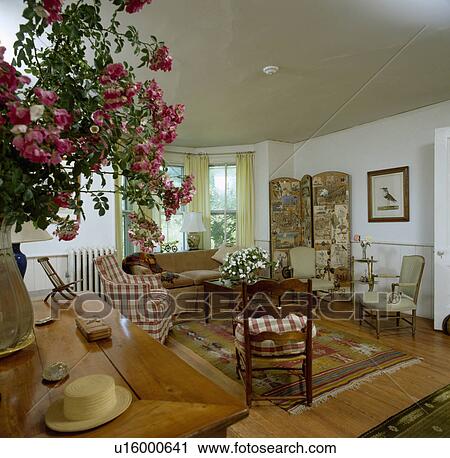 Stock Image - Traditional light country living room. Fotosearch