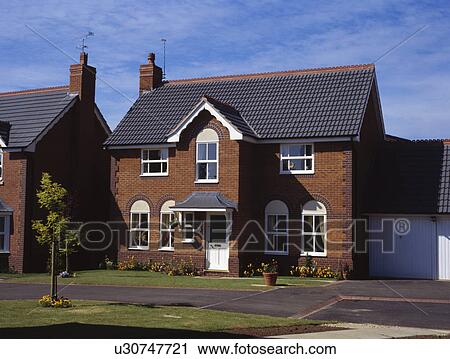 Traditional newbuild house on small housing estate View Large Photo Image Stock Image - Traditional newbuild house on small housing estate. Fotosearch