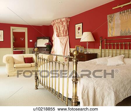Traditional red bedroom with brass bedstead and bathroom ensuite. View Large Photo Image Stock Photography - Traditional red bedroom with brass bedstead and bathroom ensuite.. Fotosearch