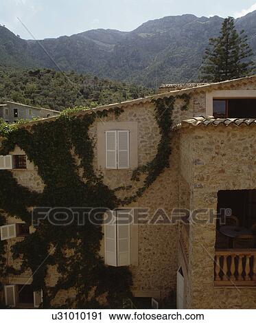 Traditional stone village house in Provence with white shutters View Large Photo Image Stock Image - Traditional stone village house in Provence with white shutters. Fotosearch