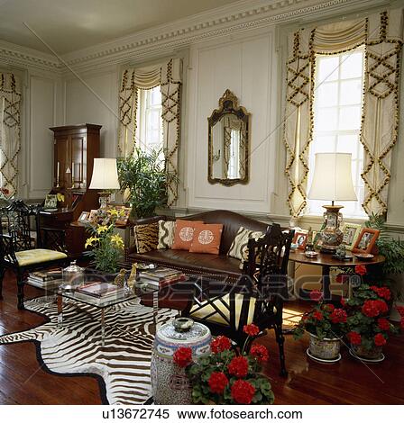 Traditional town living room with faux zebraskin rug View Large Photo Image Stock Photography - Traditional town living room with faux zebraskin rug. Fotosearch