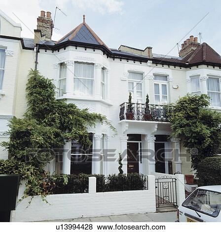 Traditional white Victorian terraced town house View Large Photo Image Stock Photo - Traditional white Victorian terraced town house. Fotosearch