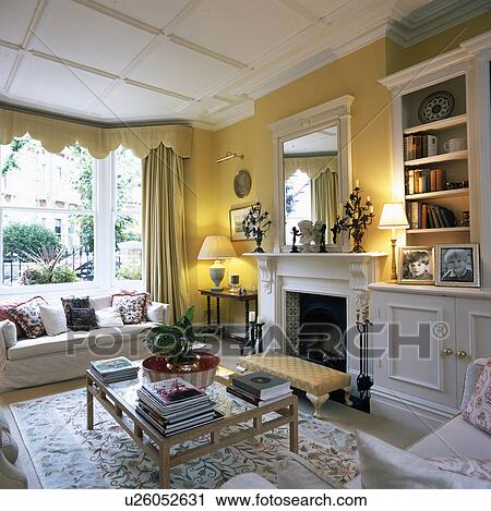 Stock Image - Traditional yellow living room. Fotosearch
