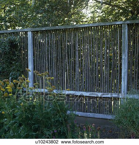Unusual boundary fence made of hazel twigs. View Large Photo Image Stock Image - Unusual boundary fence made of hazel twigs. . Fotosearch