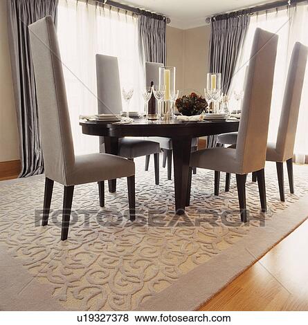 Upholstered Tall Backed Chairs In Small Hotel Dining Room Stock