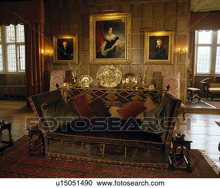 Velvet Knole Sofa In Panelled Drawingroom With Lights Above Gilt Velvet Knole Sofa In Panelled