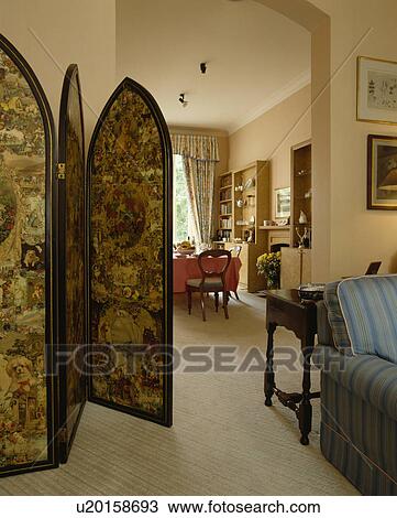 Victorian decoupage screen in living room with cream carpet and archway to traditional dining room View Large Photo Image Stock Image - Victorian decoupage screen in living room with cream carpet and archway to traditional dining room. Fotosearch