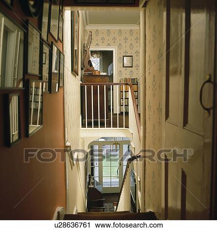 View of landing and hall from the top of the staircase in traditional country house View Large Photo Image Stock Image - View of landing and hall from the top of the staircase in traditional country house . Fotosearch