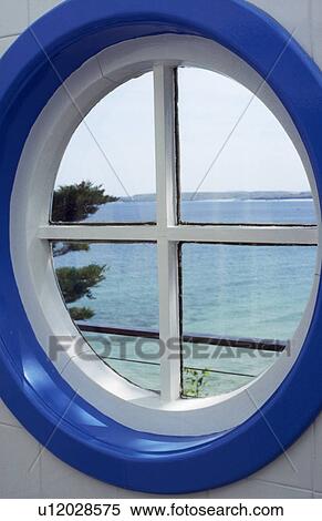 View of sea through circular blue and white window View Large Photo Image Stock Photography - View of sea through circular blue and white window. Fotosearch