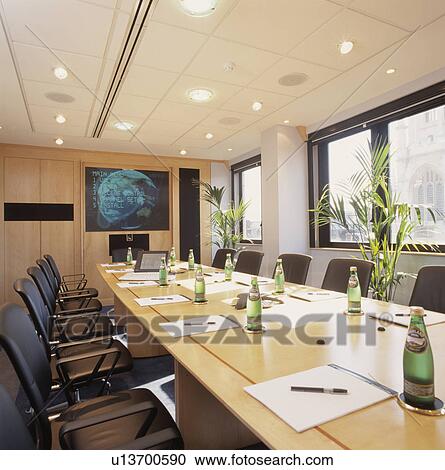 Well-lit modern designer decorated boardroom with built in monitor. View Large Photo Image Stock Image - Well-lit modern designer decorated boardroom with built in monitor.. Fotosearch