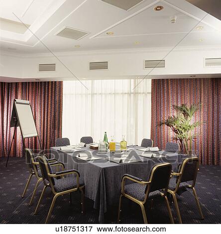 Stock Photo - Well-lit modern designer decorated boardroom.. Fotosearch