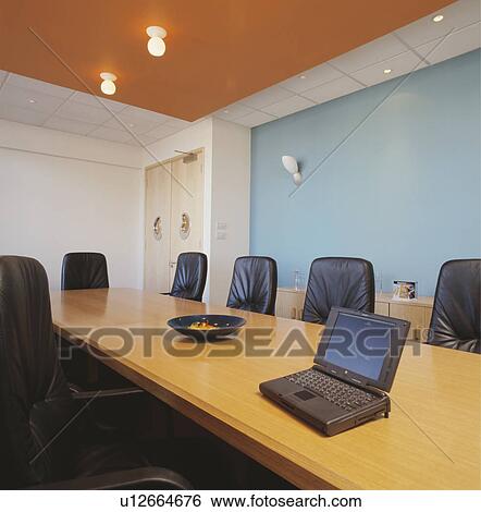 Stock Photograph - Well-lit modern designer decorated boardroom.. Fotosearch