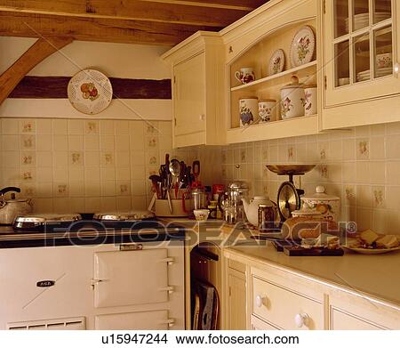 White Aga Oven In Small Cream Cottage Kitchen With Scales On