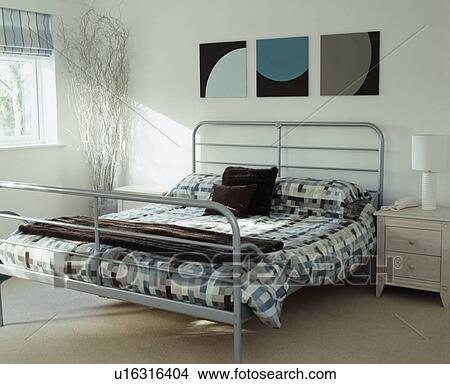 White Bedroom With Modern Tubular Steel Bed Frame And Blue