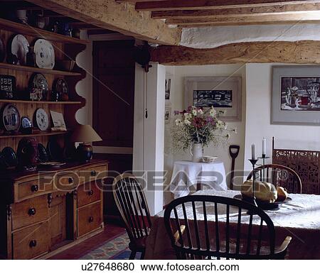Stock Photography Of White Cloth On Small Circular Table In Beamed Stock Photography Of White Cloth On Small Circular Table In Beamed