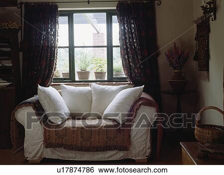 White cushions and brown throw on small white sofa View Large Photo Image Stock Photograph - White cushions and brown throw on small white sofa. Fotosearch