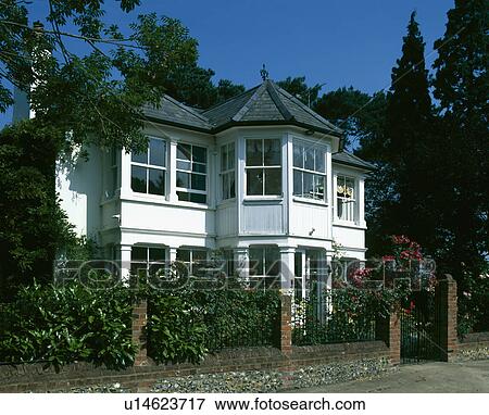 White Edwardian house with metal railings on brick wall in front of the house View Large Photo Image Stock Photo - White Edwardian house with metal railings on brick wall in front of the house. Fotosearch