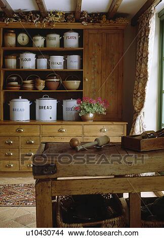 White Enamel Storage Canisters On Antique Pine Dresser In Country