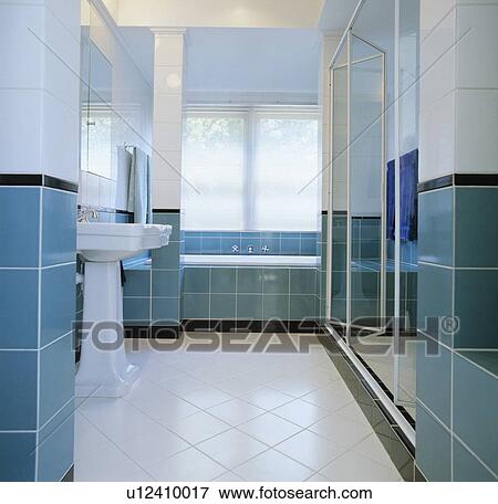 White floor tiles in modern turquoise and white tiled bathroom View Large Photo Image Stock Photo - White floor tiles in modern turquoise and white tiled bathroom. Fotosearch