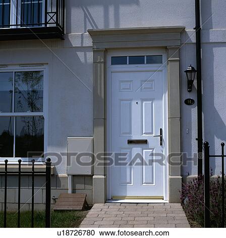 White front door in traditional town house with concealed gas meter on the wall View Large Photo Image Stock Image - White front door in traditional town house with concealed gas meter on the wall. Fotosearch