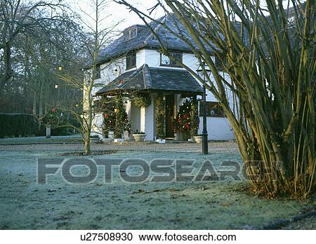 Stock Image - White house in the country in winter. Fotosearch