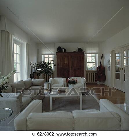 White leather sofas and armchairs in white living room View Large Photo Image Stock Image - White leather sofas and armchairs in white living room. Fotosearch