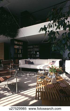 Stock Photography - White sofa in modern black living room. Fotosearch