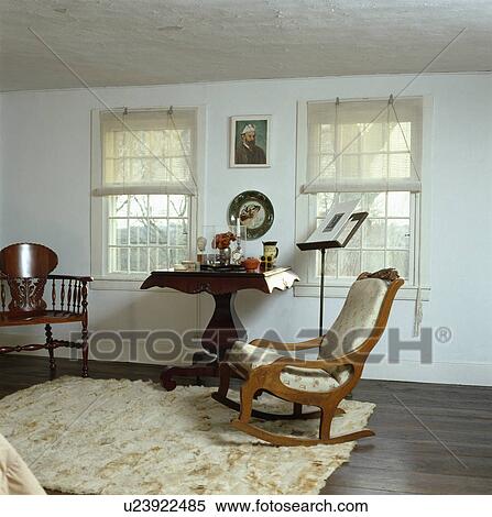 White Split Cane Blinds On Windows In White Bedroom With Antique