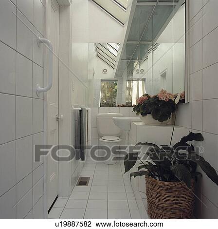 White tiled architectural bathroom View Large Photo Image Stock Image - White tiled architectural bathroom. Fotosearch