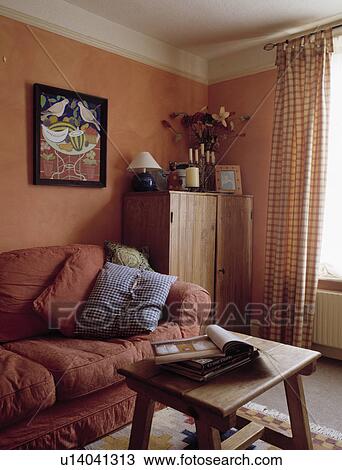 Wooden coffee table in terracotta traditional living room View Large Photo Image Stock Image - Wooden coffee table in terracotta traditional living room. Fotosearch