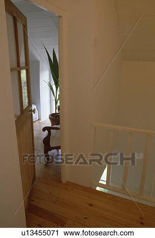 Wooden floor on white landing with door open to bedroom View Large Photo Image Stock Image - Wooden floor on white landing with door open to bedroom. Fotosearch