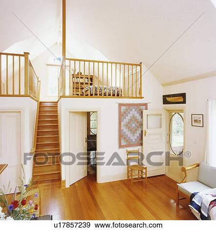 Wooden Flooring And Staircase To Bedroom On Mezzanine Floor In