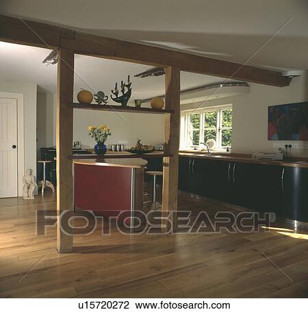 Wooden flooring in modern country kitchen with exposed upright and ceiling beams View Large Photo Image Stock Image - Wooden flooring in modern country kitchen with exposed upright and ceiling beams . Fotosearch