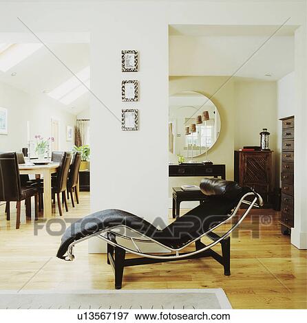 Wooden flooring in modern living room with Le Corbusier black leather chaiselongue View Large Photo Image Stock Photo - Wooden flooring in modern living room with Le Corbusier black leather chaiselongue. Fotosearch
