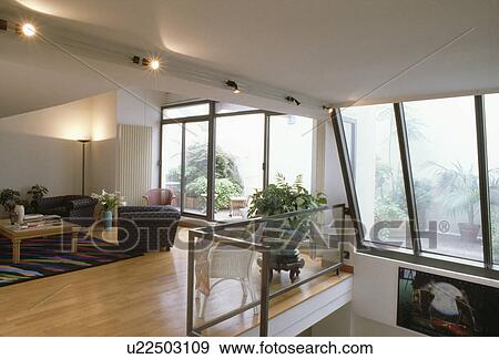 Wooden flooring in modern living room in loft apartment View Large Photo Image Stock Photo - Wooden flooring in modern living room in loft apartment. Fotosearch