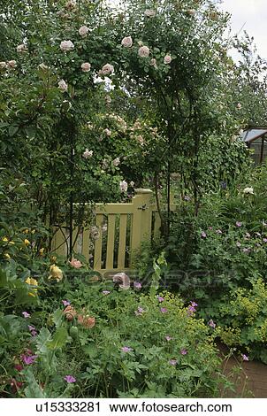 Stock Image - Wooden gate in country garden. Fotosearch