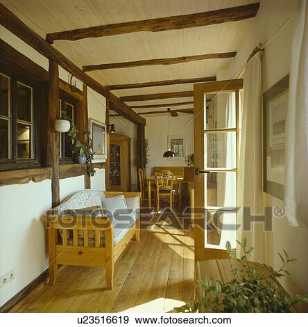 Wooden settle in hall extension with wooden floor View Large Photo Image Stock Photo - Wooden settle in hall extension with wooden floor. Fotosearch